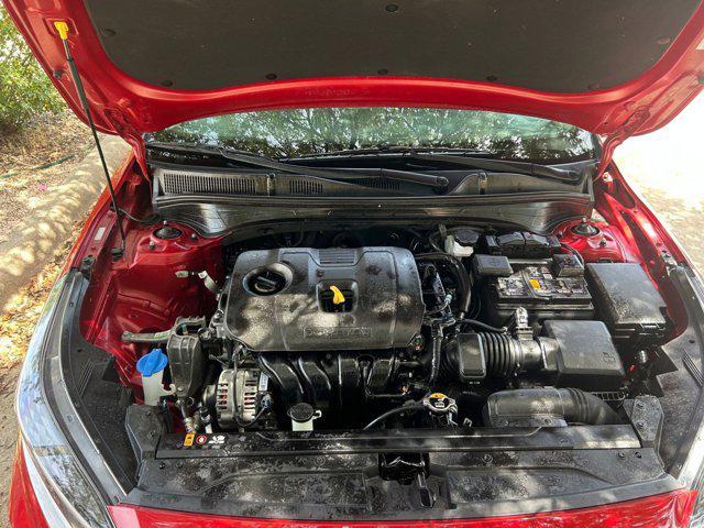 Photo of 2024 Currant Red Kia Forte