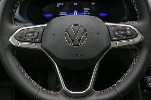 Photo of 2023 Cornflower Blue Volkswagen Taos