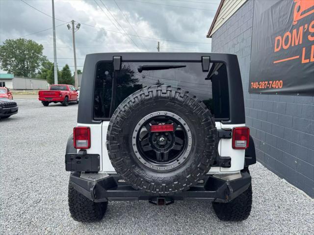Photo of 2014 Bright White Clearcoat Jeep Wrangler Unlimited