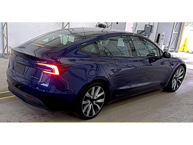 Photo of 2024 Deep Blue Metallic Tesla Model 3