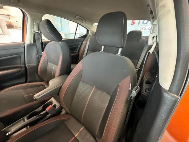 Photo of 2021 Monarch Orange Pearl Met Nissan Versa