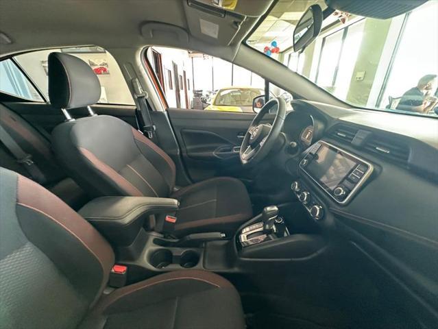 Photo of 2021 Monarch Orange Pearl Met Nissan Versa