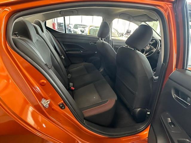 Photo of 2021 Monarch Orange Pearl Met Nissan Versa