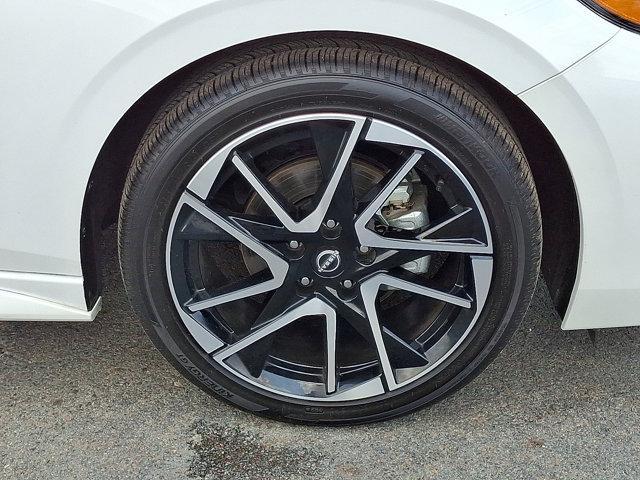 Photo of 2024 Aspen White Tricoat Nissan Sentra