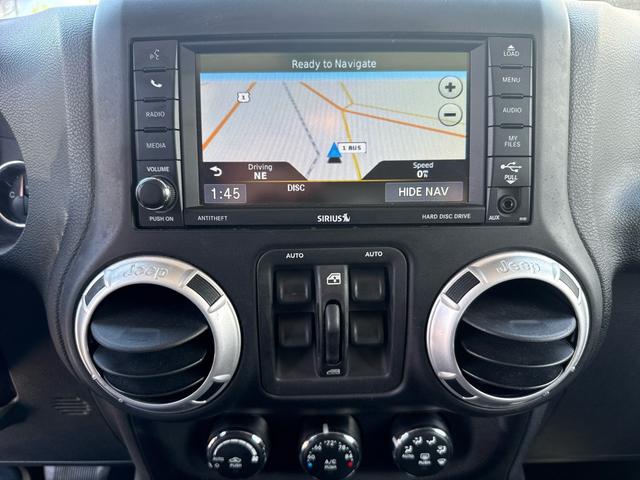 Photo of 2014 gray granite Jeep Wrangler Unlimited