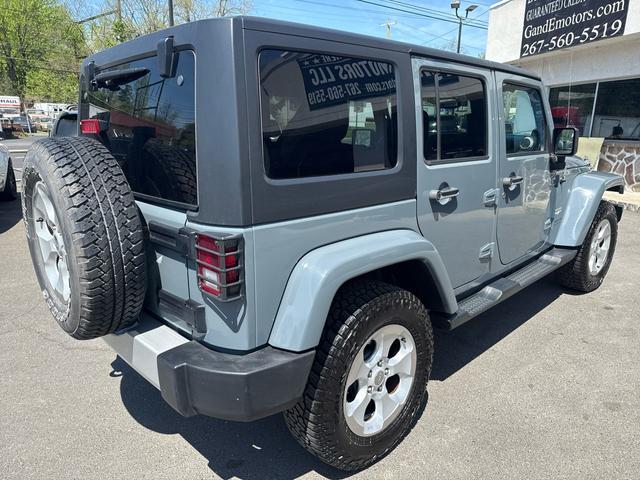 Photo of 2014 gray granite Jeep Wrangler Unlimited