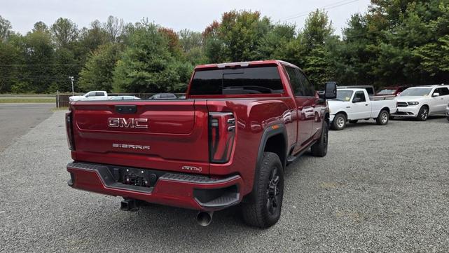 Photo of 2024 Volcanic Red Tintcoat GMC Sierra 2500