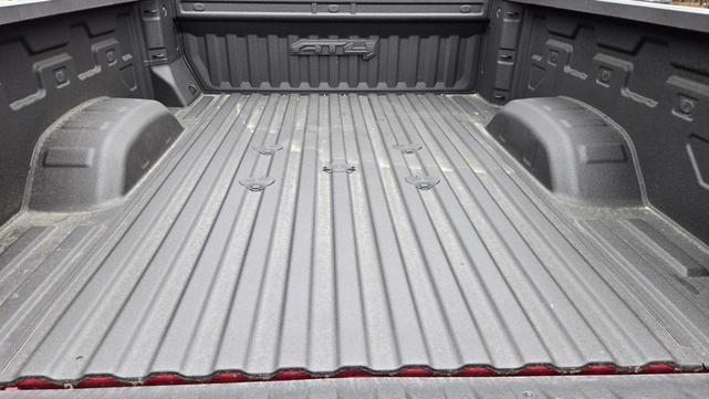 Photo of 2024 Volcanic Red Tintcoat GMC Sierra 2500