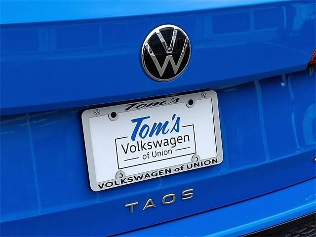 Photo of 2022 Cornflower Blue Volkswagen Taos