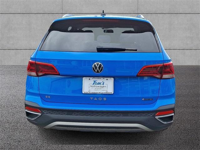 Photo of 2022 Cornflower Blue Volkswagen Taos
