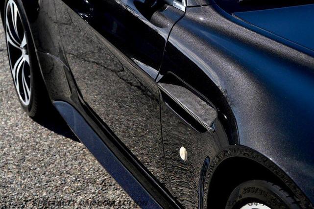 Photo of 2011 Carbon Black Metallic Aston Martin V12 Vantage