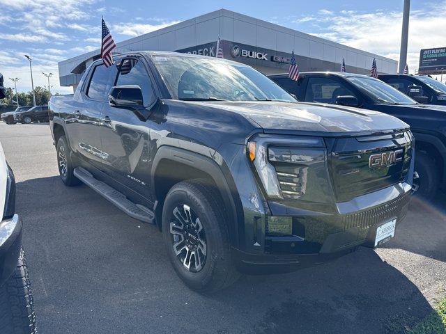 Photo of 2026 Deep Ocean Metallic GMC Sierra EV