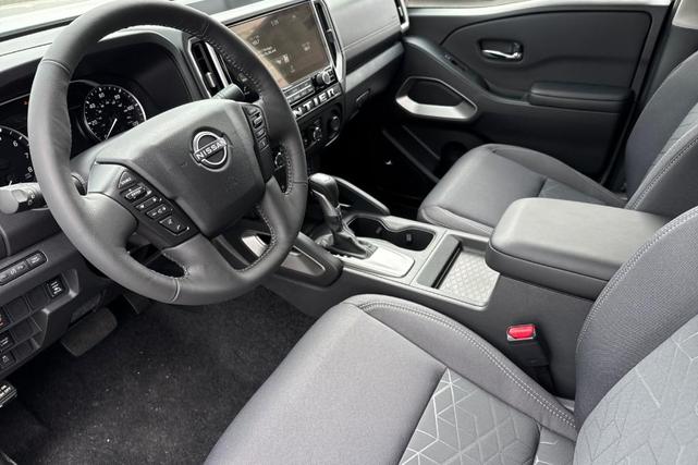 Photo of 2025 Glacier White Nissan Frontier