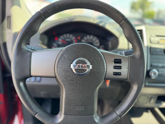 Photo of 2012 Lava Red Nissan Frontier