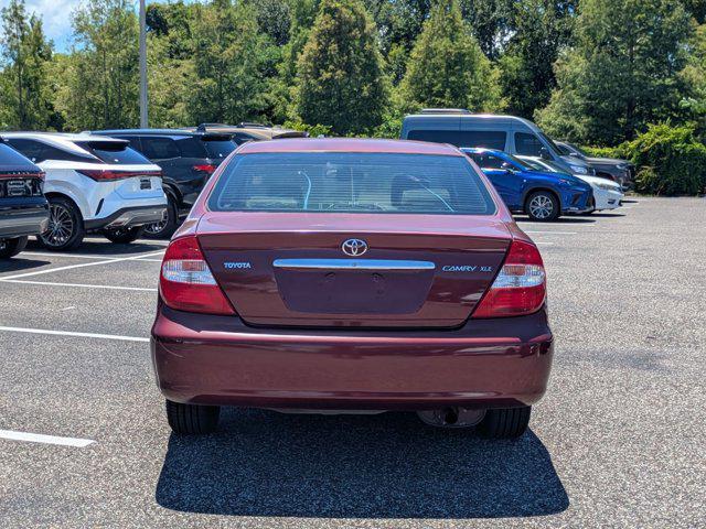 Photo of 2004 Salsa Red Pearl [R Toyota Camry