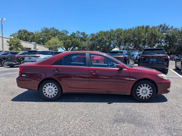Photo of 2004 Salsa Red Pearl [R Toyota Camry