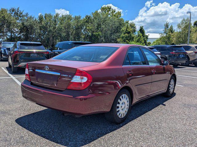 Photo of 2004 Salsa Red Pearl [R Toyota Camry