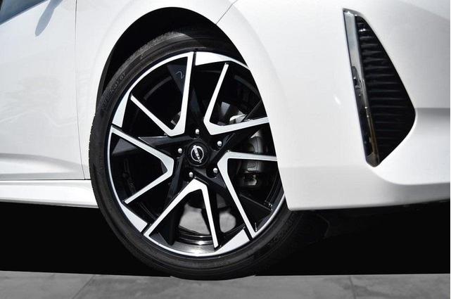 Photo of 2024 Aspen White Tricoat Nissan Sentra