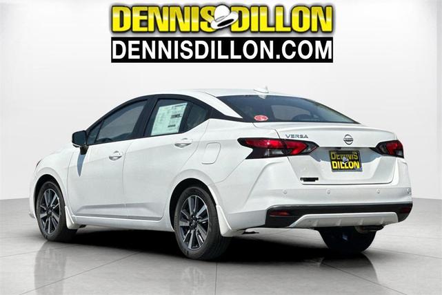 Photo of 2025 Aspen White Tricoat Nissan Versa