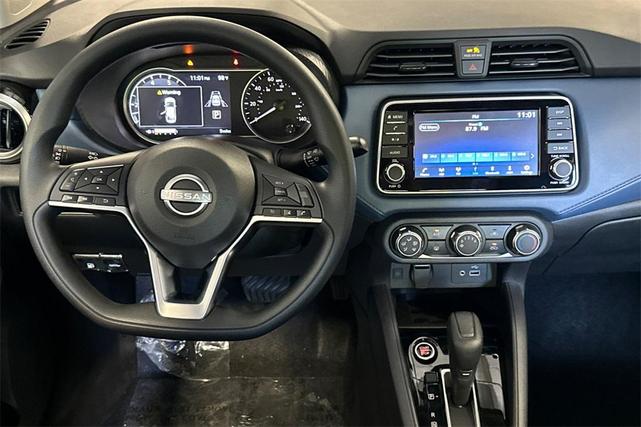 Photo of 2025 Aspen White Tricoat Nissan Versa