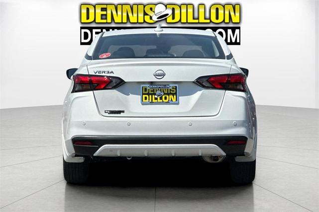 Photo of 2025 Aspen White Tricoat Nissan Versa