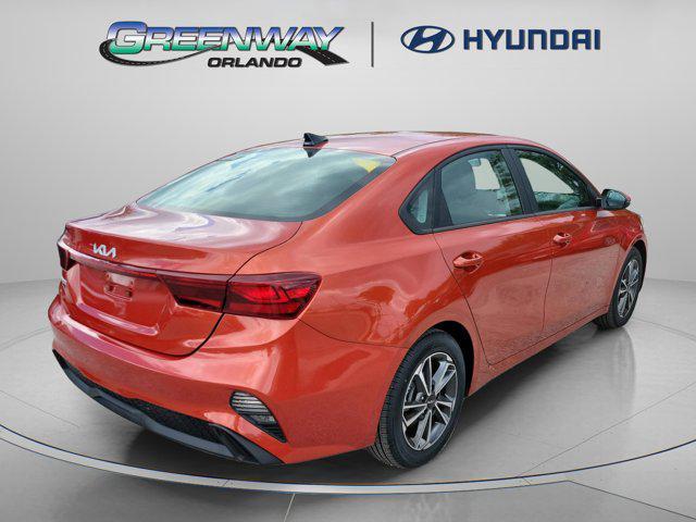 Photo of 2022 Fire Orange Kia Forte