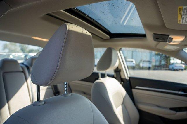 Photo of 2023 Pearl White Tricoat Nissan Altima