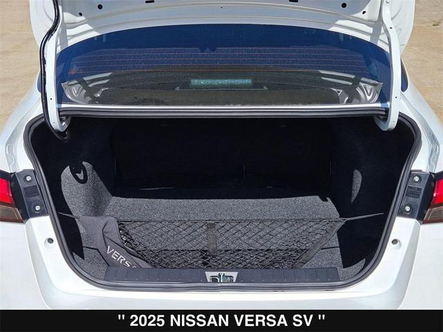 Photo of 2025 Aspen White Tricoat Nissan Versa