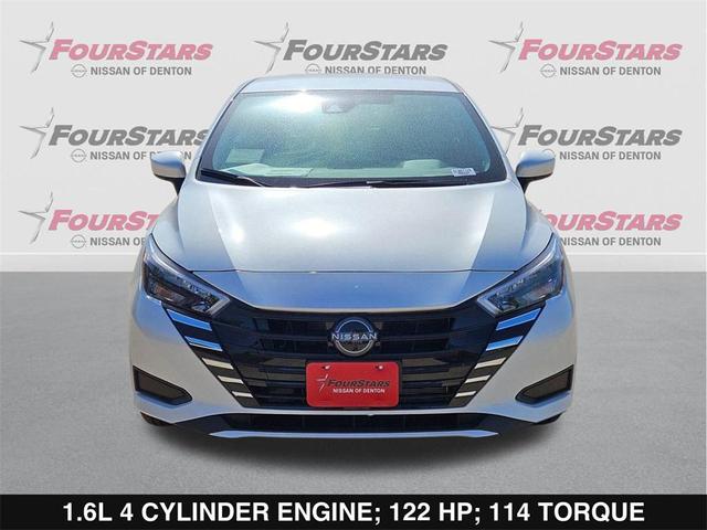 Photo of 2025 Aspen White Tricoat Nissan Versa