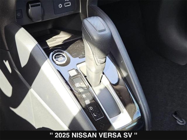 Photo of 2025 Aspen White Tricoat Nissan Versa