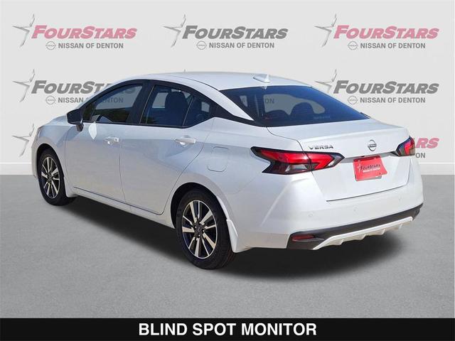 Photo of 2025 Aspen White Tricoat Nissan Versa