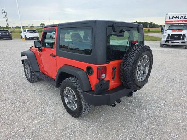 Photo of 2015 Sunset Orange Pearlcoat Jeep Wrangler
