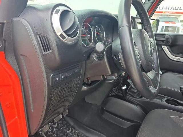 Photo of 2015 Sunset Orange Pearlcoat Jeep Wrangler