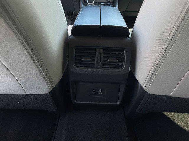 Photo of 2023 Pearl White Tricoat Nissan Rogue