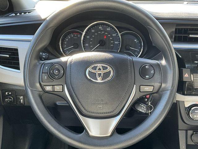 Photo of 2014 Super White Toyota Corolla