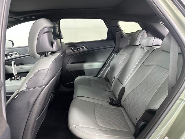 Photo of 2023 Jungle Green/Ebony Black Roof Kia Sportage