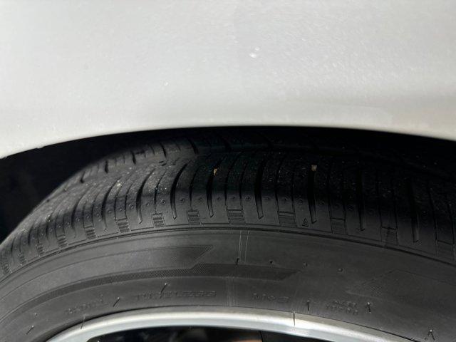 Photo of 2024 Aspen White Tricoat/Super Black Nissan Sentra