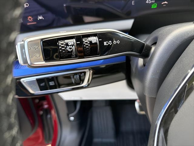 Photo of 2025 Radiant Red Tintcoat Cadillac OPTIQ