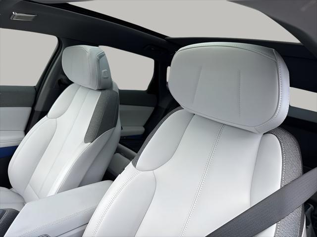 Photo of 2025 Radiant Red Tintcoat Cadillac OPTIQ