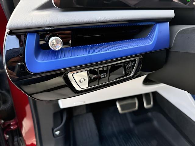 Photo of 2025 Radiant Red Tintcoat Cadillac OPTIQ