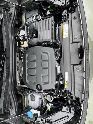 Photo of 2025 Avocado Green w/Deep Black Roof Volkswagen Tiguan