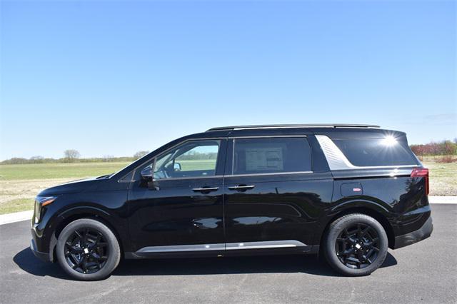 Photo of 2025 Aurora Black Pearl Kia Carnival Hybrid