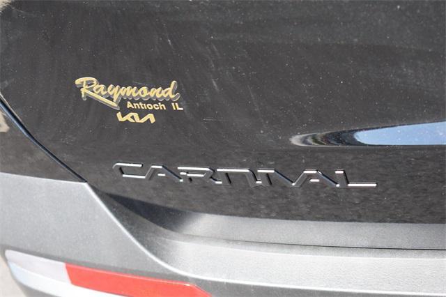 Photo of 2025 Aurora Black Pearl Kia Carnival Hybrid