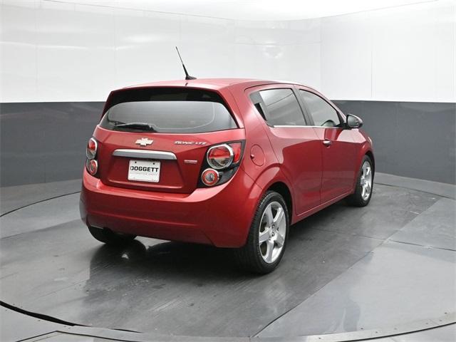 Photo of 2014 Crystal Red Tintcoat Chevrolet Sonic
