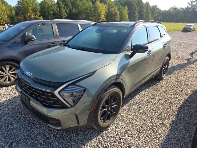 Photo of 2023 Jungle Green/Ebony Black Roof Kia Sportage