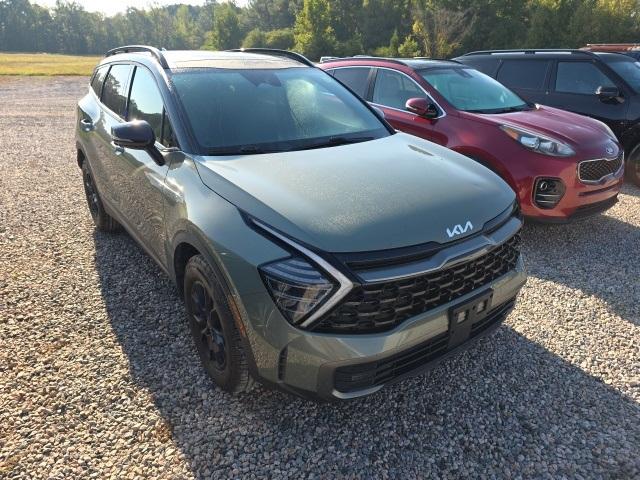 Photo of 2023 Jungle Green/Ebony Black Roof Kia Sportage
