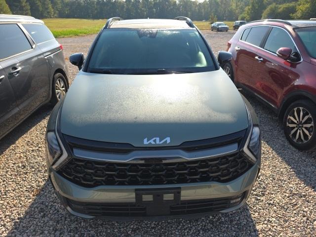Photo of 2023 Jungle Green/Ebony Black Roof Kia Sportage