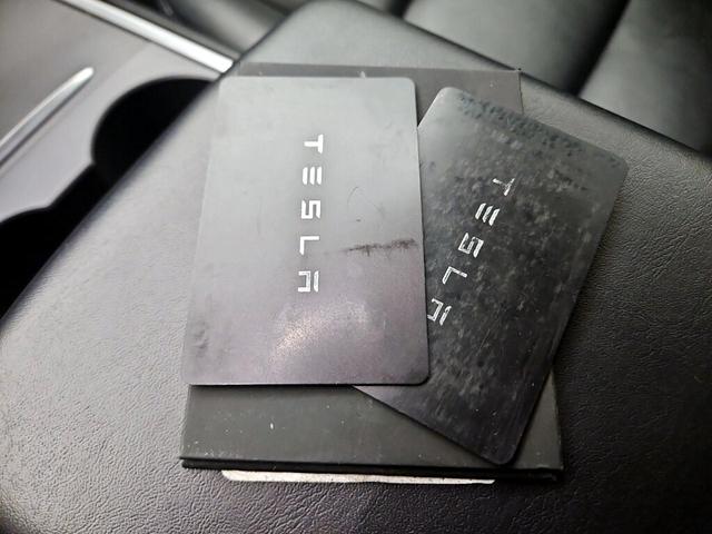 Photo of 2021 Burgundy Tesla Model 3