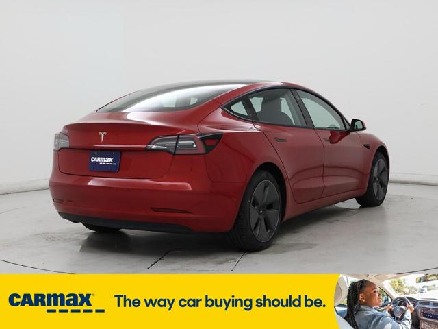 Photo of 2021 Burgundy Tesla Model 3