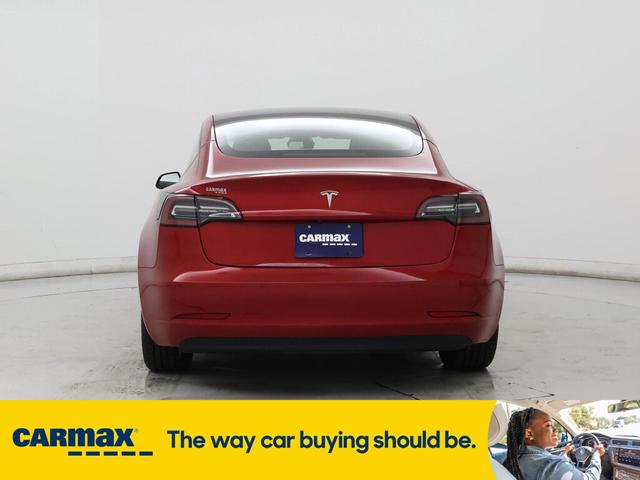 Photo of 2021 Burgundy Tesla Model 3